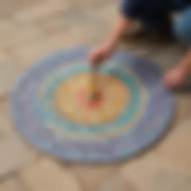 Craftsman applying colorful mosaic to paver stone