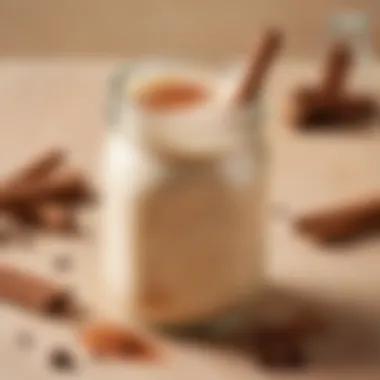 A creamy smoothie in a mason jar with a sprinkle of cinnamon on top