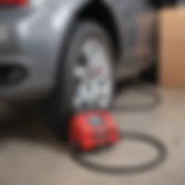 Costco tire inflator being used in a garage setting with a car in the background.
