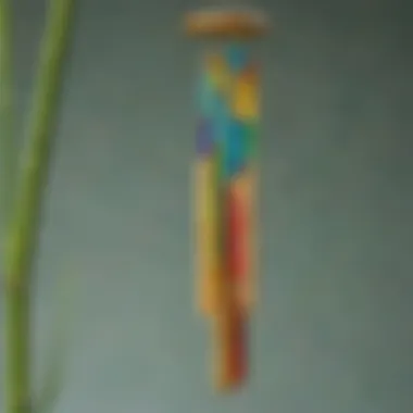 An artistic wind chime made of bamboo tubes and colorful glass beads swaying in the breeze