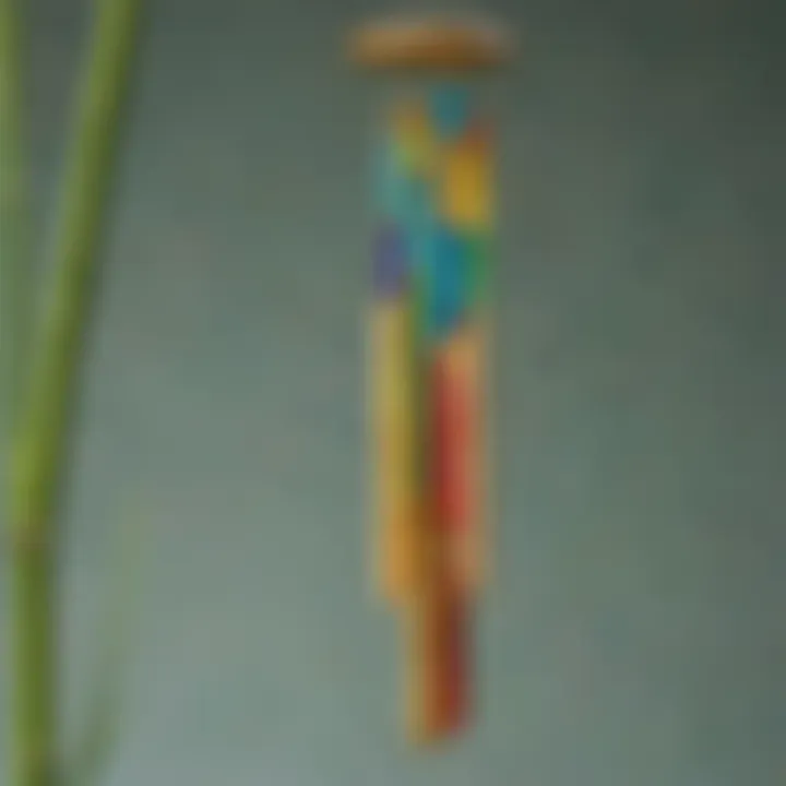 An artistic wind chime made of bamboo tubes and colorful glass beads swaying in the breeze