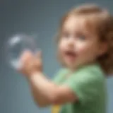 Young child playing with soap bubbles