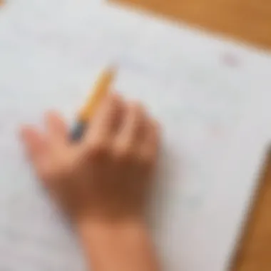 Close-up of a child's hand tracing letters in a workbook