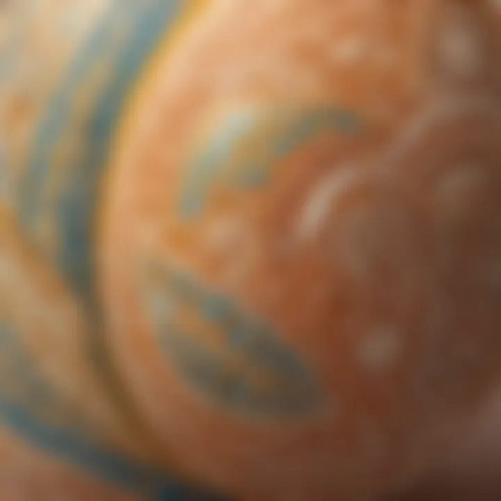 Close-up of an egg being adorned with intricate patterns using a fine brush.