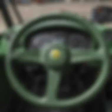 Detailed view of the Peg Perego John Deere Tractor's steering wheel