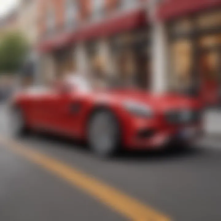 Young child riding in a sleek red luxury car