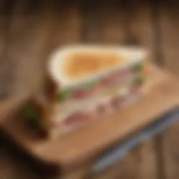 A beautifully styled turkey slice sandwich on a rustic wooden table